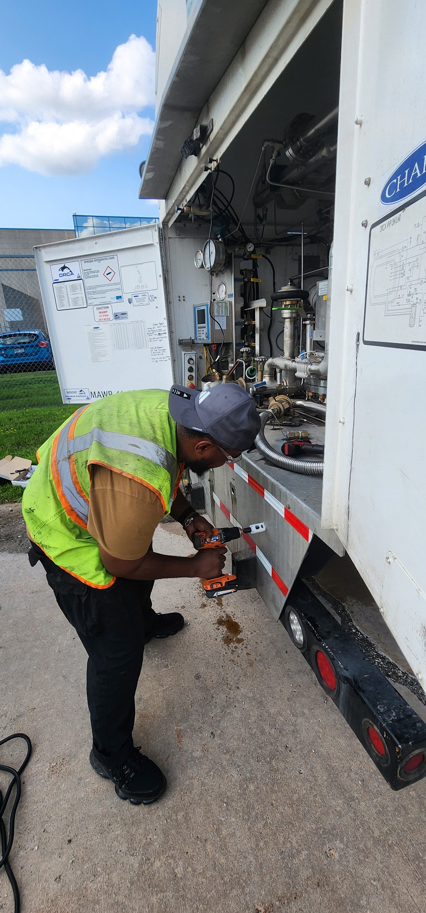 Tru Mobile Tech technician installing telematics on an ORCA industrial gas tanker