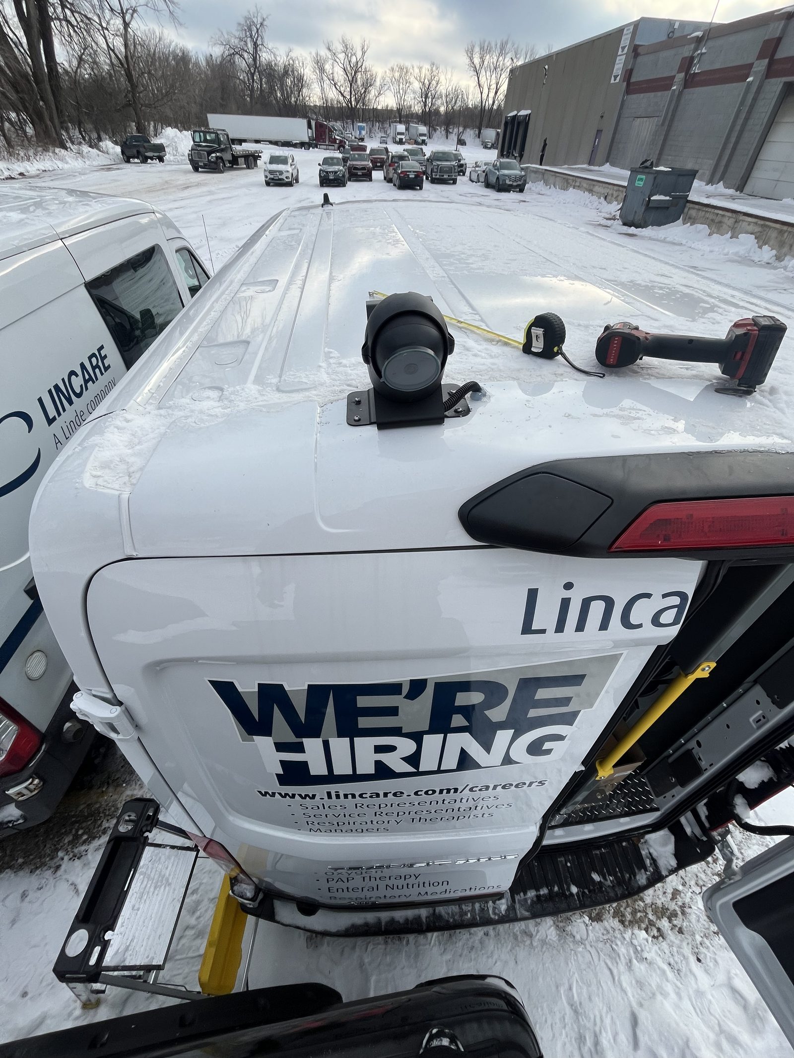 Clean rear-mounted backup camera installation on a fleet SUV